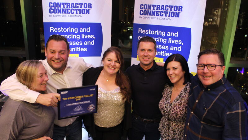 Group of Contractor Connection employees posing together at Contractor Connection Top Performers Banquet