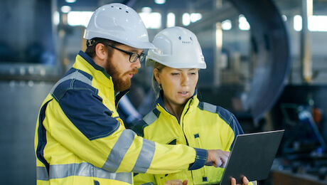 Forensic engineers working on a job site