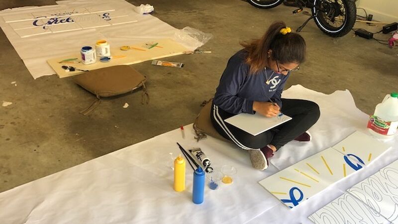 Crawford creative guru, Sabatani Shetu, hand crafts the final art pieces.