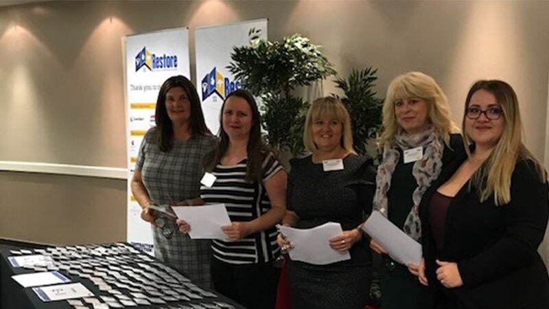 Crawford UK employees welcome guest to the 2019 Contractor Connection Conference