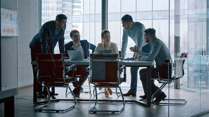 Workers in an office conference room