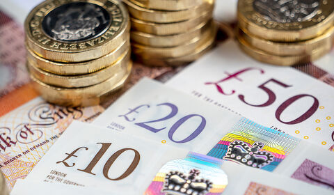 Various world currencies in coins and bills.