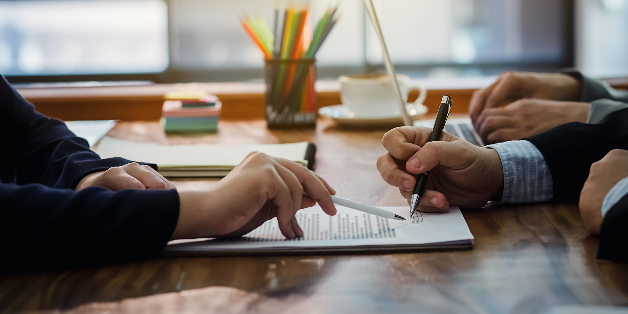 People working together on signing a contract