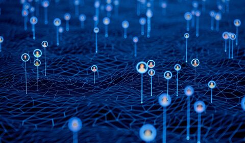 A digital landscape with a network of interconnected nodes, each displaying circular icons of diverse individuals against a blue background