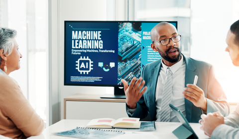 Three people seated at a table engaged in a discussion