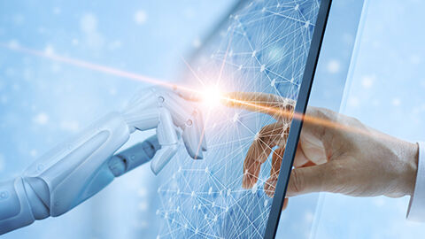Robotic finger interacting with human hand.