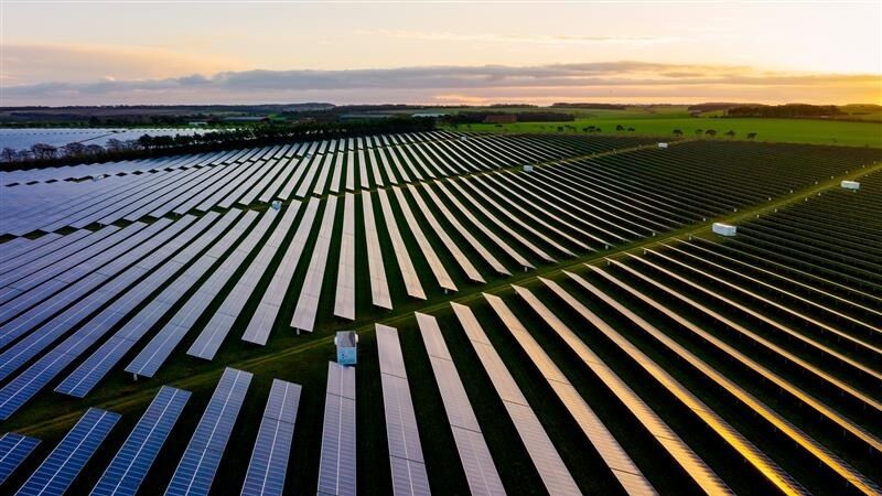 Vast solar farm at sunset