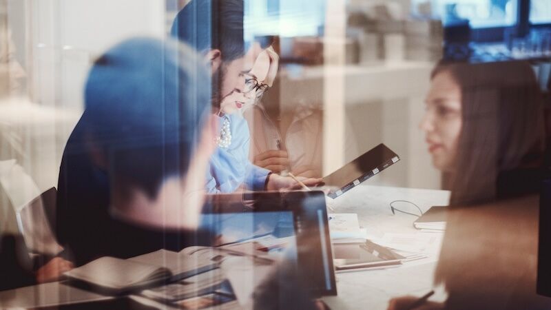Multiple coworkers collaborating in a conference room