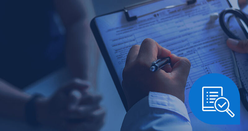 A hand holding a pen fills out a clipboard with a form, while another person's hands rest in the background