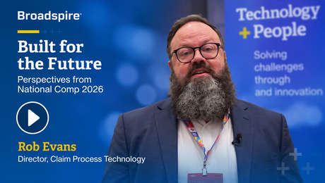 A person with a beard speaks about technology and innovation at an event, with text overlay about their role and the event's theme