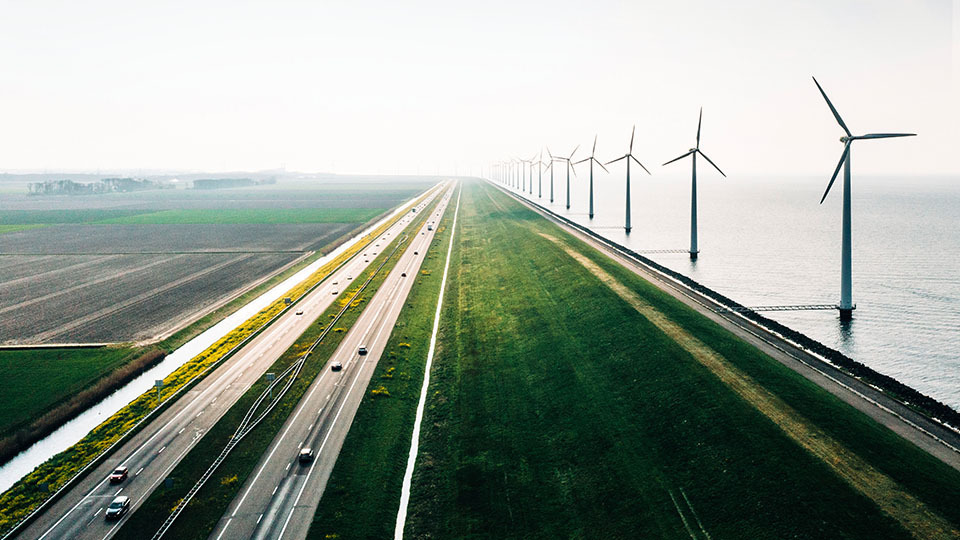 Expansive roadway near to windmills